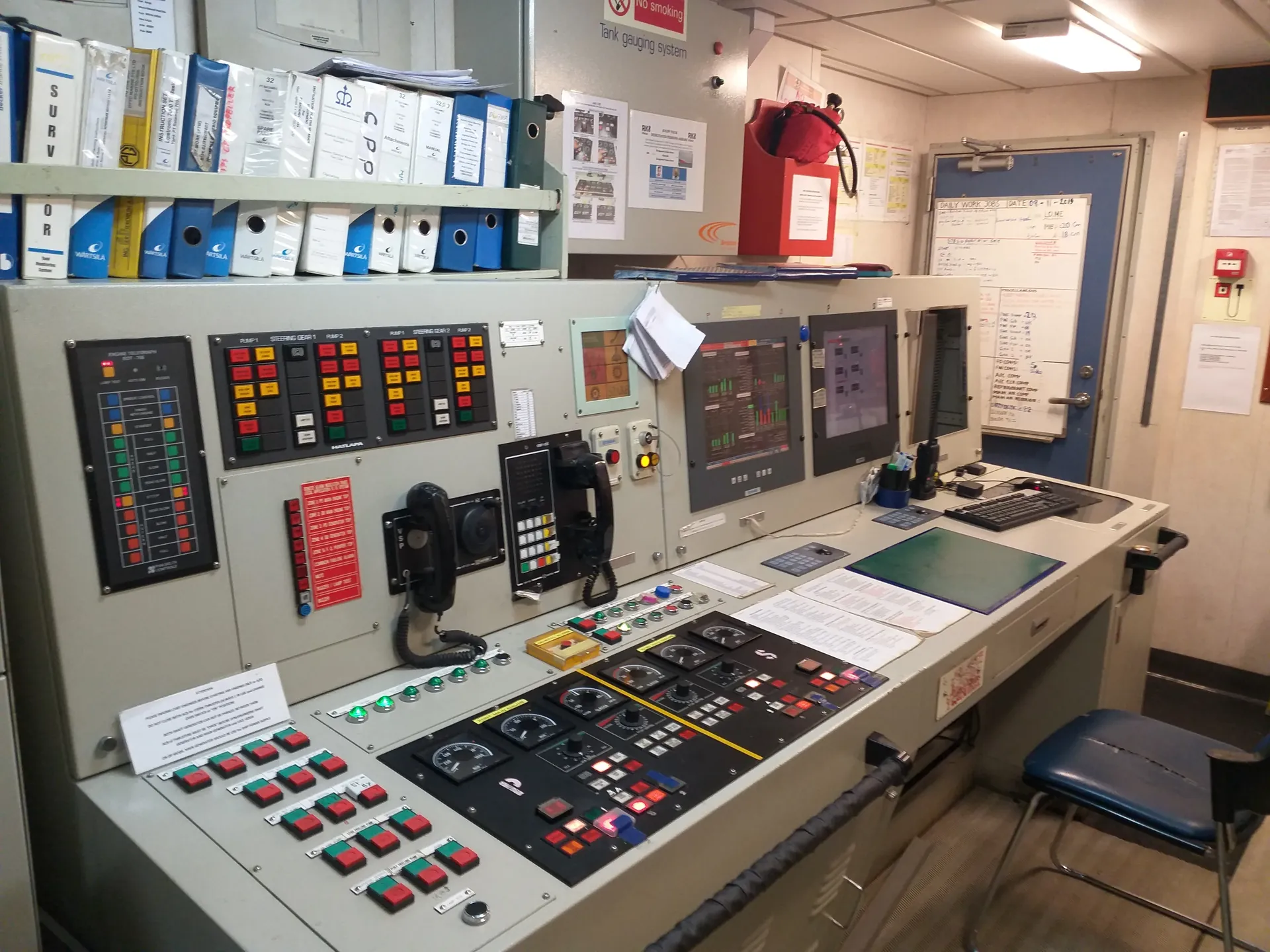 Vessel engine control room console with steering gear and pump control panels serviced by Kenoc