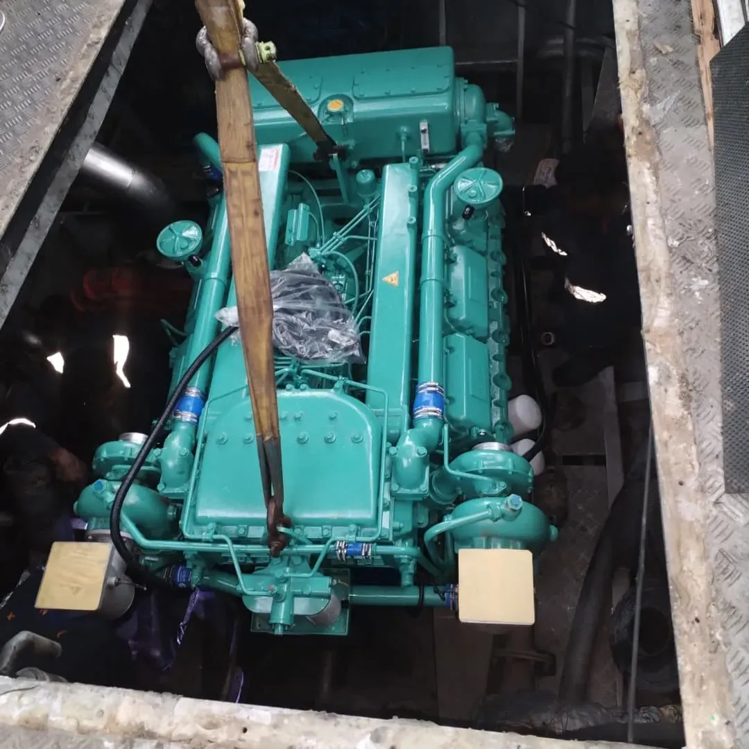 Marine engine being lowered into a vessel's engine bay during installation by Kenoc